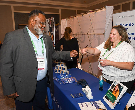 Lamont Repollet visits the Solutions Lab at the 2022 Annual Conference.