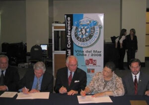 AASCU member presidents and chancellors signing MOUs in Chile, 2008.