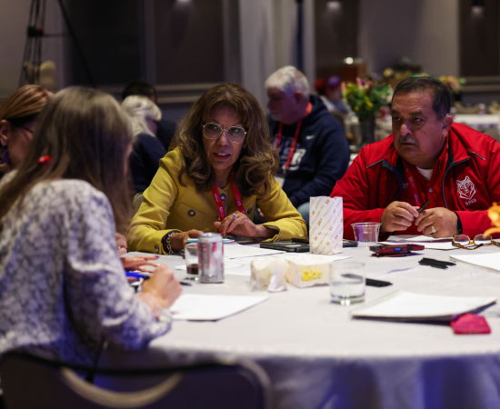 Cynthia Teniente-Matson of San José State University and Carlos Hernandez of Sul Ross State University (TX) collaborate with other presidents during a breakout.