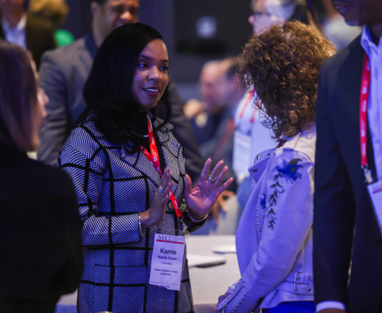 Karrie Dixon of North Carolina Central University catches up with Oakland University's Ora Pescovitz.