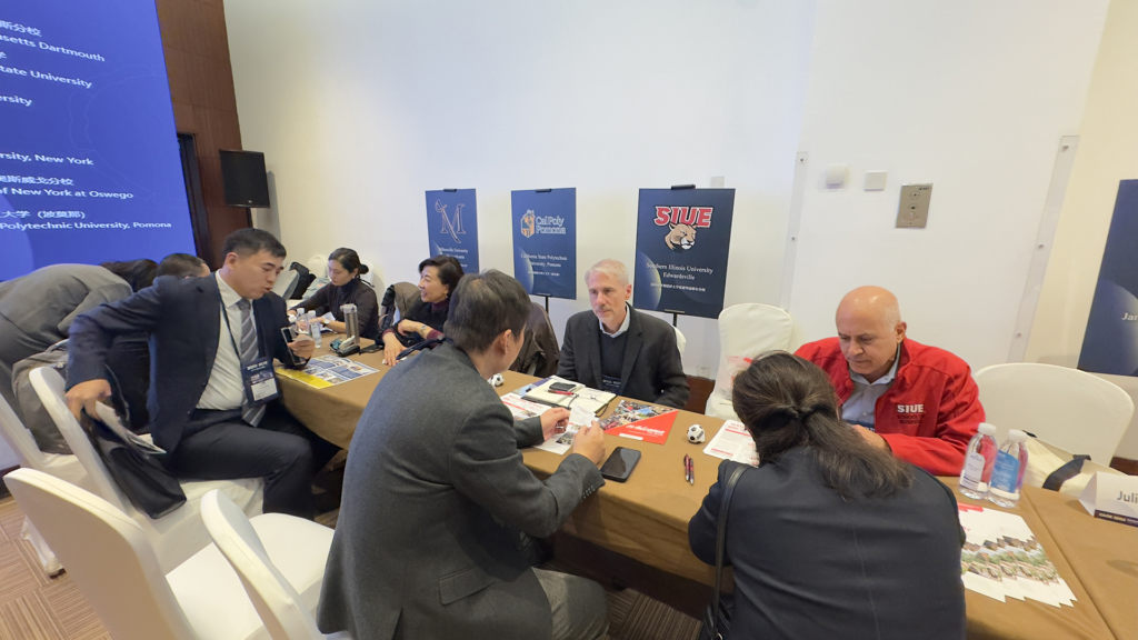 AASCU delegation members in partnership development meetings with Chinese university colleagues.